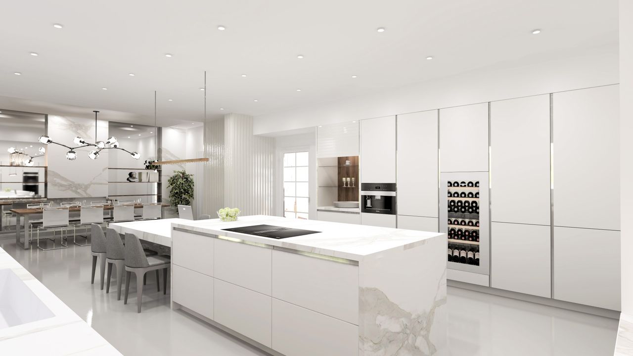 Services Contemporary kitchen featuring a sleek white island and elegant lighting.