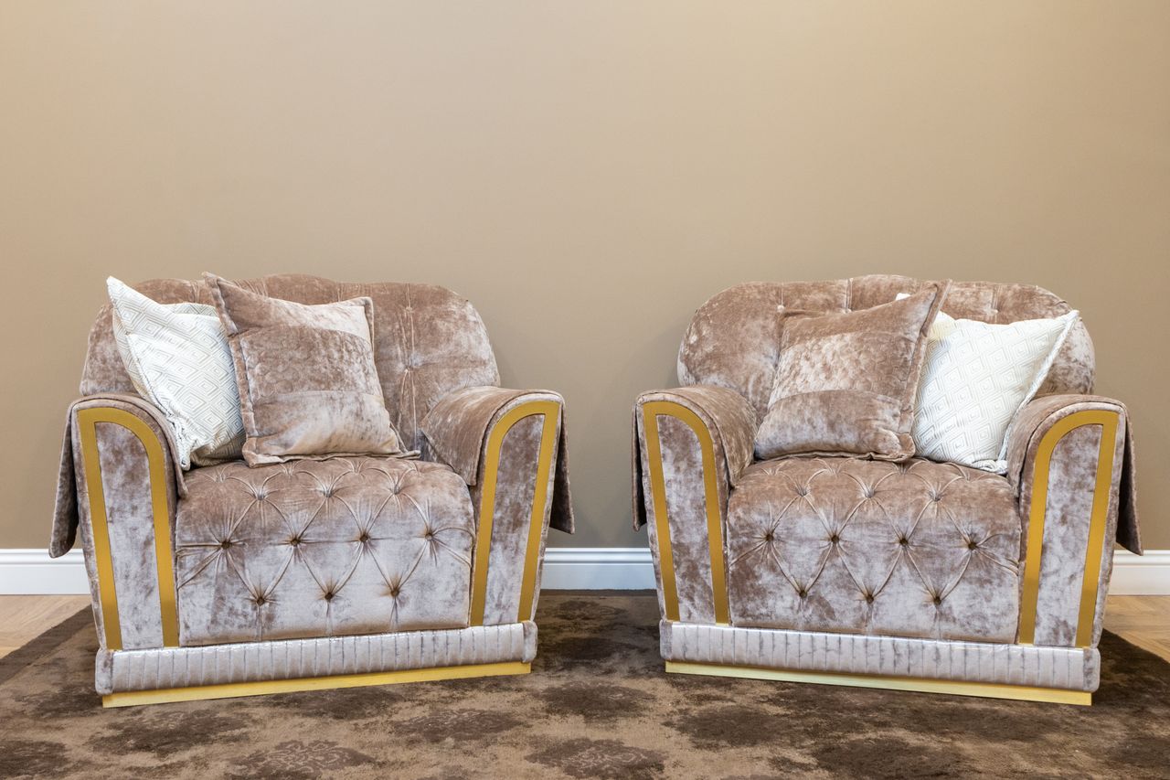 Crafting Captivating Headlines: Your awesome post title goes here Two plush velvet armchairs in a cozy modern living room setting.